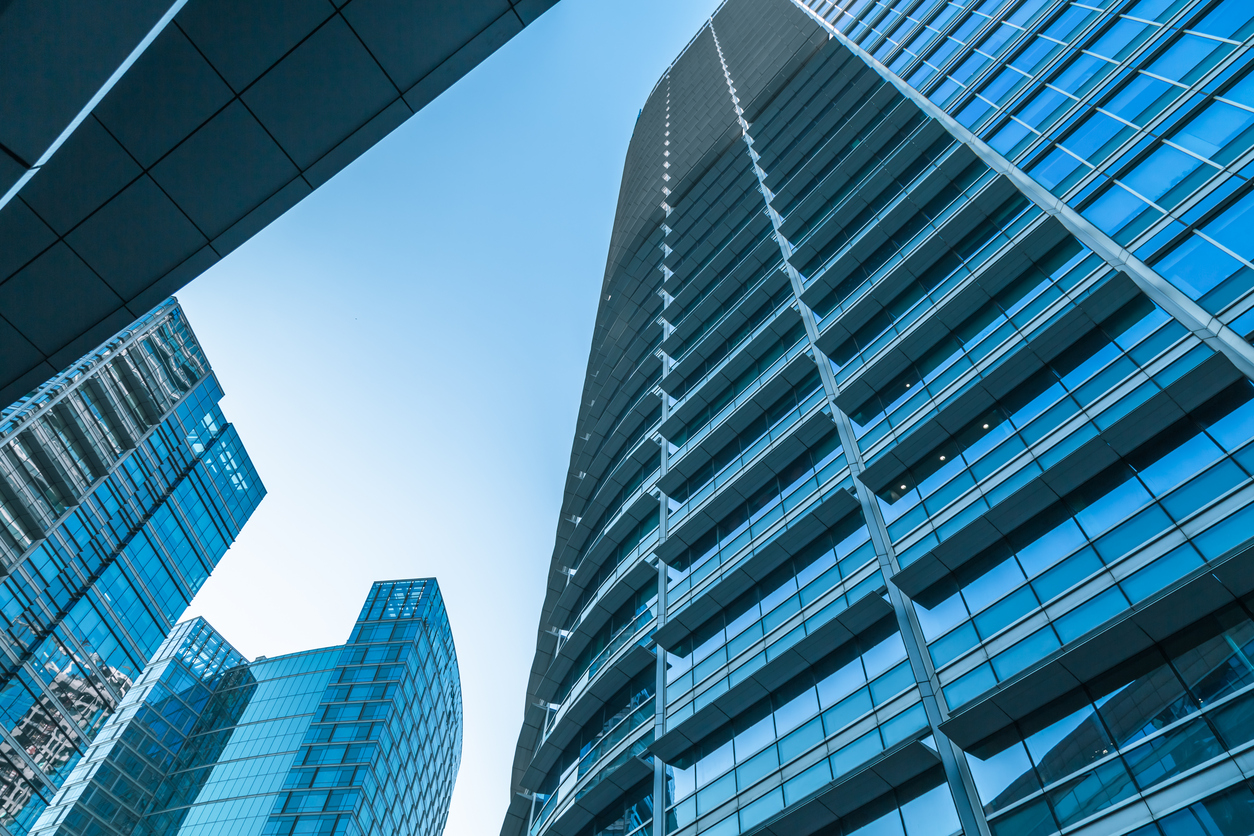 Tall office buildings with glass curtain wall exteriors